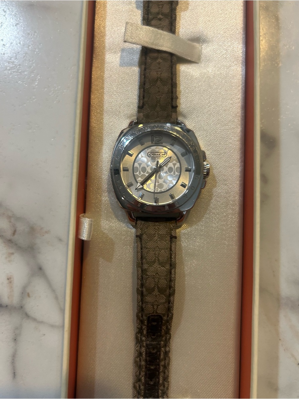 COACH brown and silver logo strap women’s watch